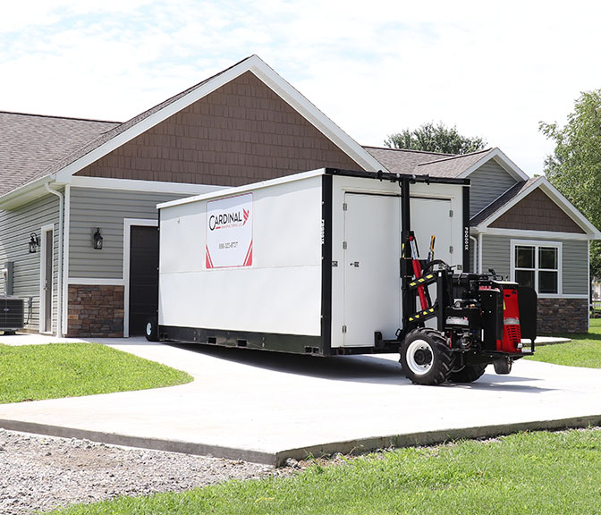 Cardinal Mule delivering equipment to a home owners garage.